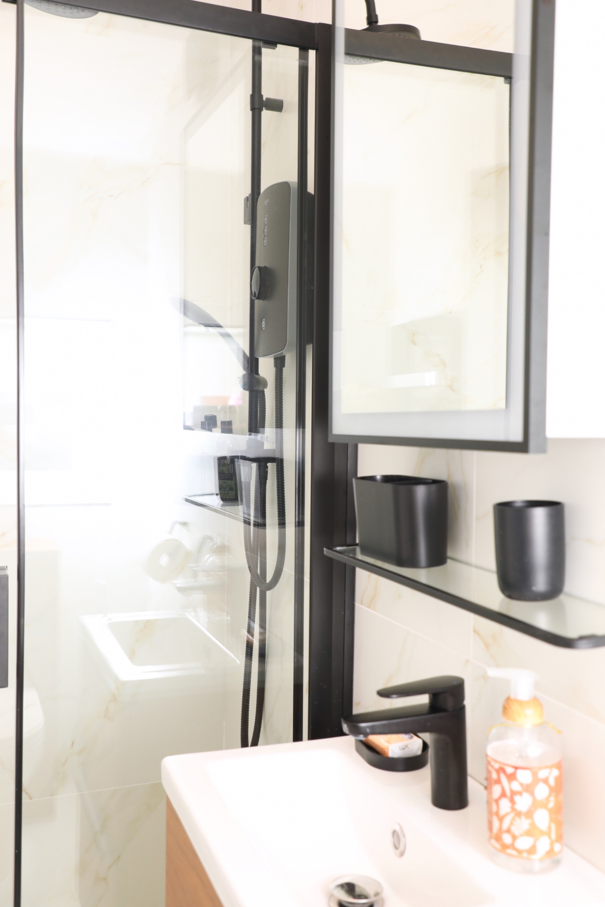 Bathroom vanity and black shower details