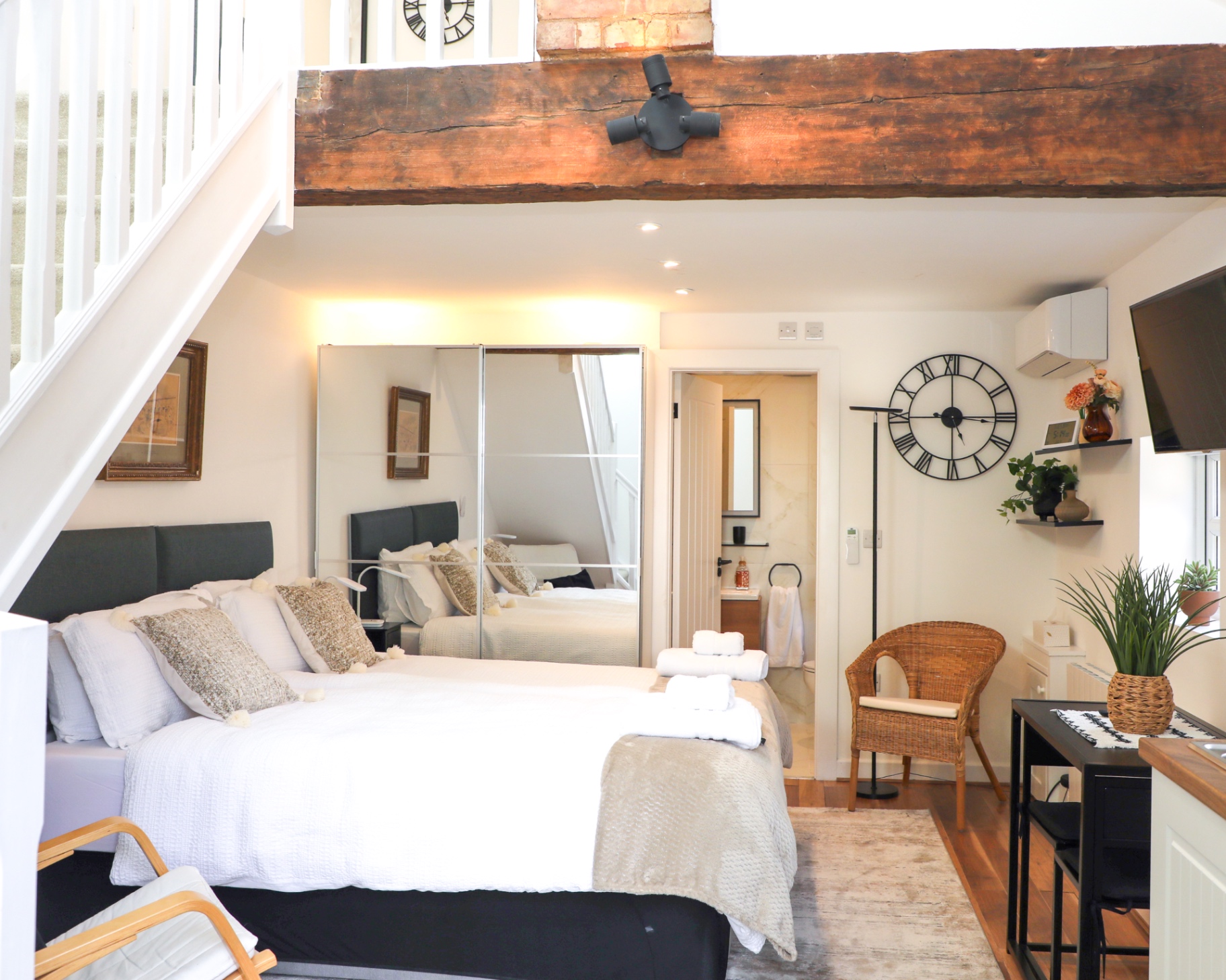 The original timber beam running above the main bedroom